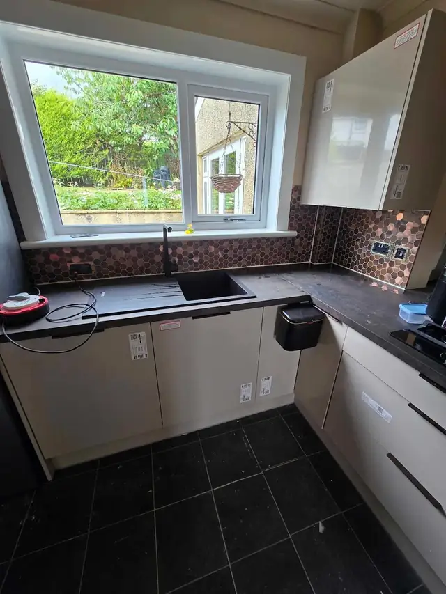Copper mosaic splashback in a kitchen